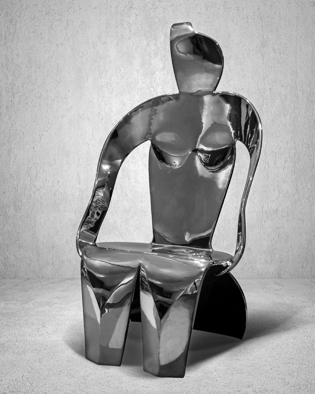 Seated female figure, stainless steel sculpture exploring void and solid